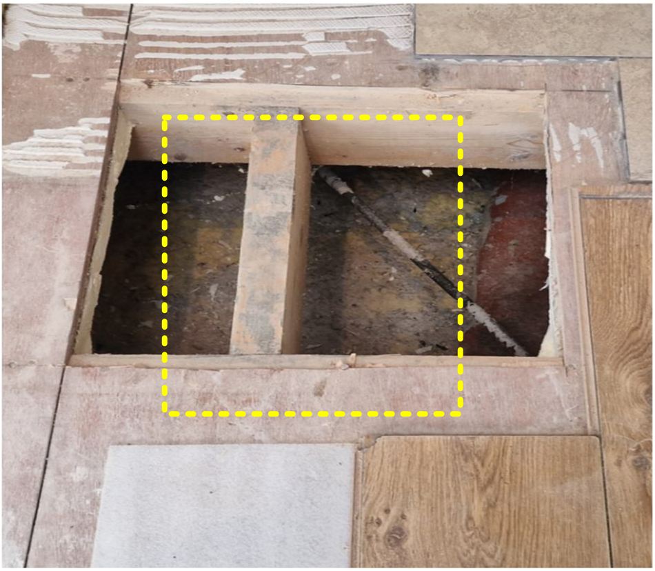 3. Removal of plywood sub-floor exposing the manhole cover -Kitchen floor opened to expose buried manhole during drain repair